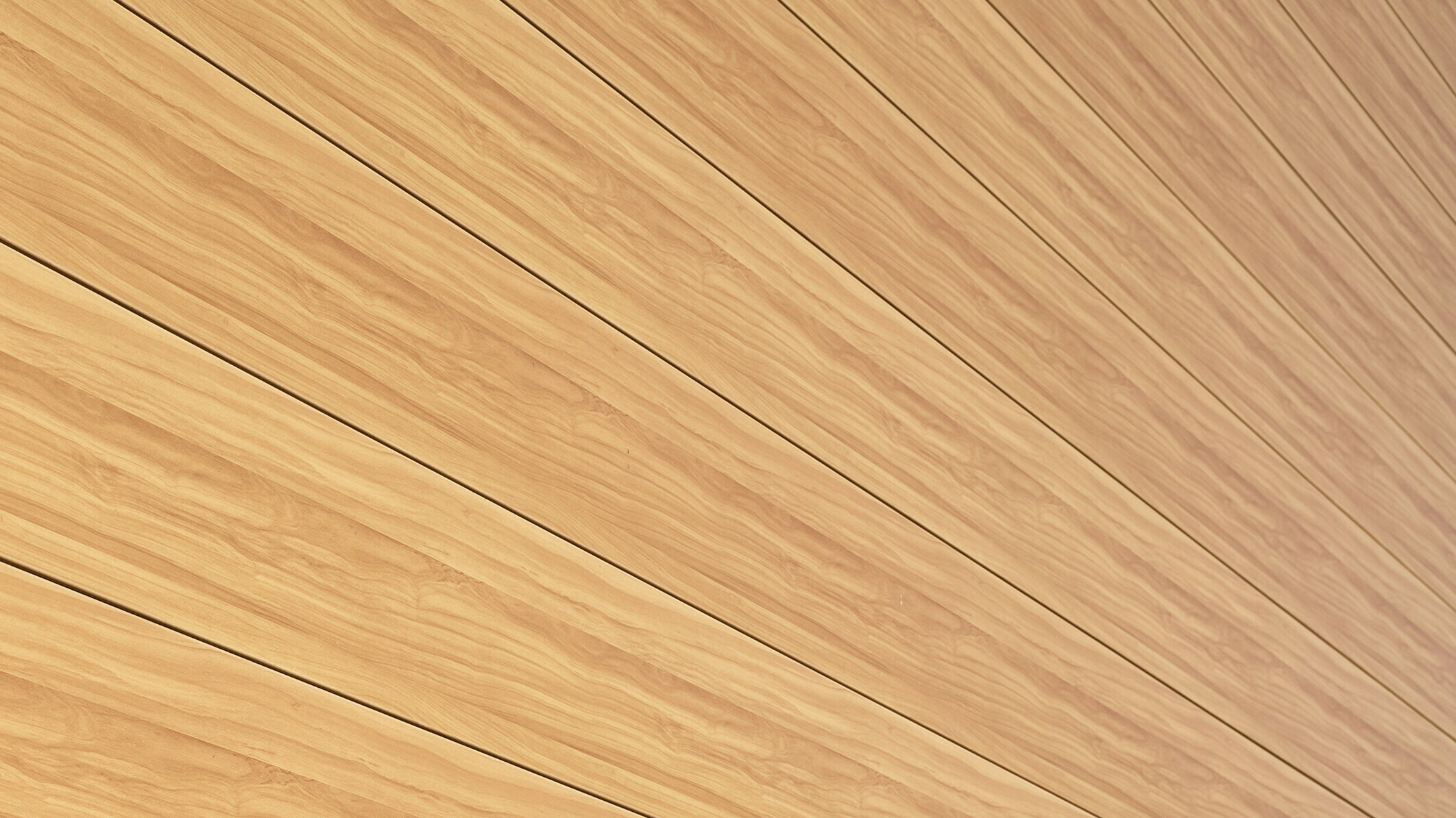 Zbliżenie na aluminiową fasadę z Sidingu PREFA w kolorze dębu naturalnego w domu jednorodzinnym w Usingen w Niemczech.