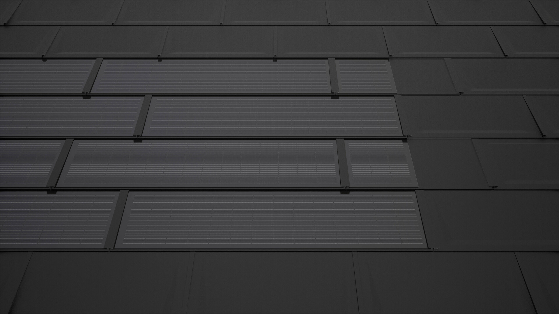 Dachówki solarne PREFA w kolorze czarnym z płytami uzupełniającymi. Zapewniają one prostokątną powierzchnię modułu i przyczyniają się do harmonijnego wyglądu dachu solarnego.